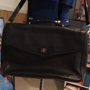 Black leather Coach briefcase with shoulder strap